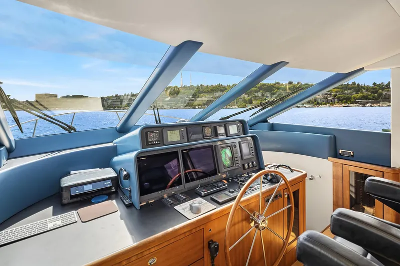 Slide: The Image of Pilothouse interior of 2003 Pacific Mariner yacht with navigation equipment and scenic water view. - 17