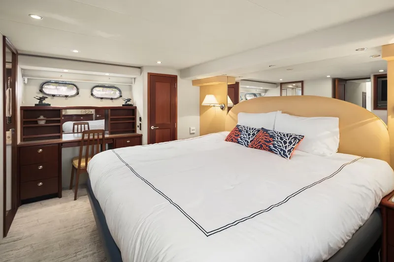 Slide: The Image of Luxurious bedroom in 2003 Pacific Mariner Pilothouse yacht with elegant decor and cozy bedding. - 20