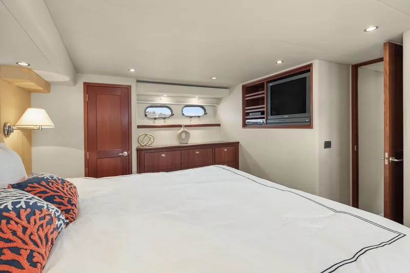 Slide: The Image of Luxurious bedroom interior of 2003 Pacific Mariner Pilothouse yacht with modern decor. - 21