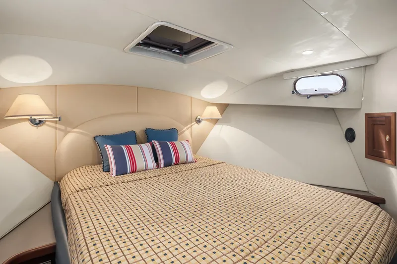 Slide: The Image of Luxurious 2003 Pacific Mariner Pilothouse bedroom with cozy bedding and elegant lighting. - 25