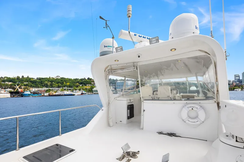 Slide: The Image of 2003 Pacific Mariner Pilothouse yacht on water, featuring sleek design and modern amenities. - 28
