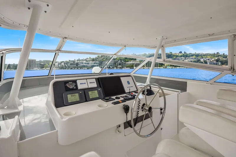 Slide: The Image of 2003 Pacific Mariner Pilothouse yacht helm with panoramic water views. - 30