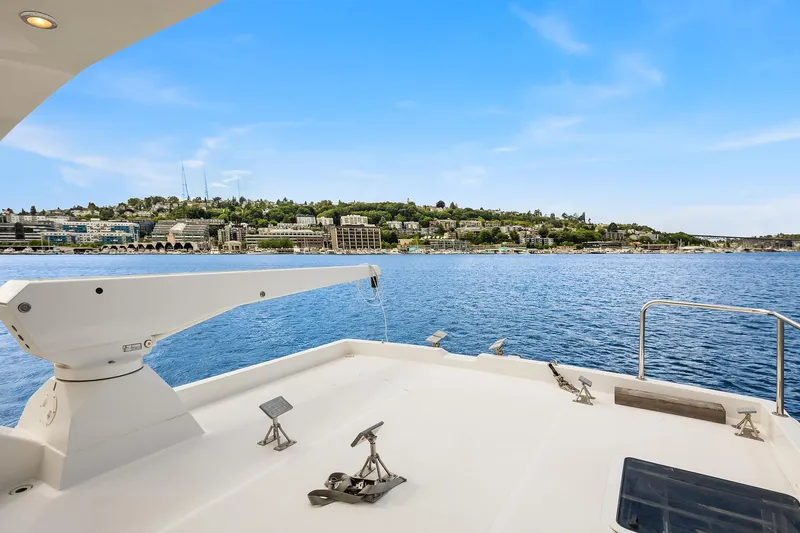 Slide: The Image of 2003 Pacific Mariner Pilothouse yacht deck with scenic waterfront view. - 32