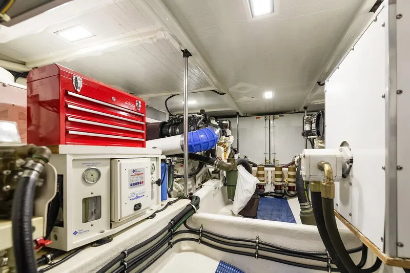 Slide: The Image of Engine room of 2003 Pacific Mariner Pilothouse with tools and equipment. - 37