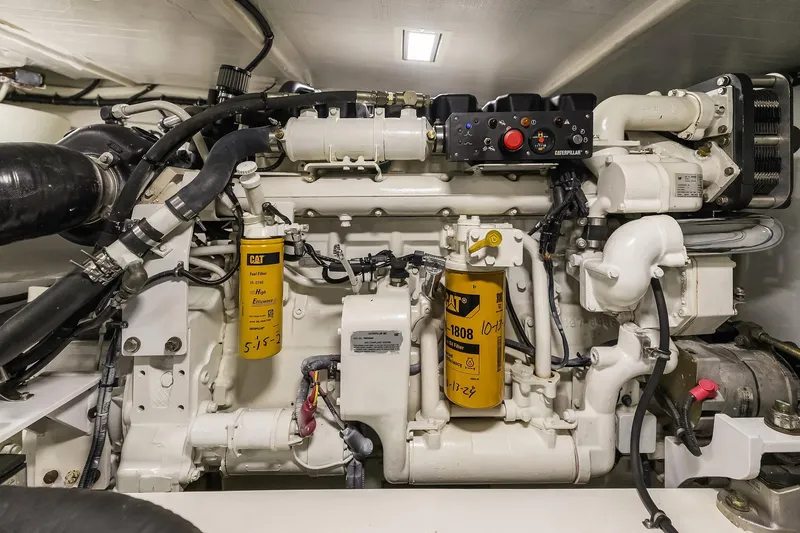 Slide: The Image of Engine room of 2003 Pacific Mariner Pilothouse yacht, featuring detailed machinery and components. - 40