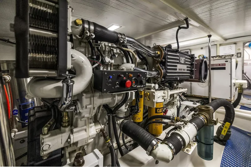 Slide: The Image of Engine room of 2003 Pacific Mariner Pilothouse yacht, featuring CAT machinery and components. - 41