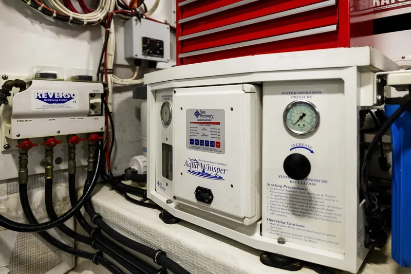 Slide: The Image of Control panel and gauges in a 2003 Pacific Mariner Pilothouse yacht engine room. - 42