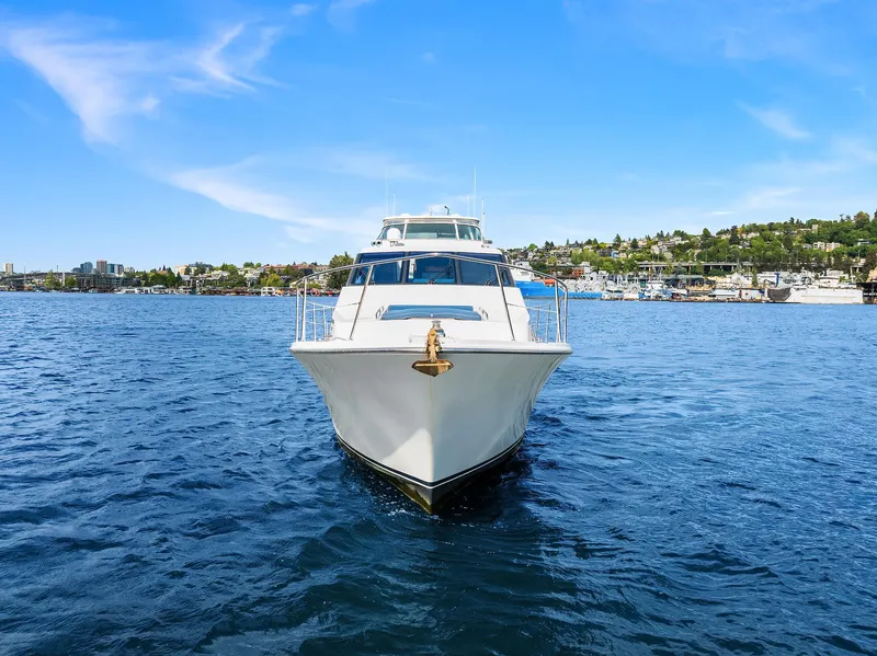 Slide: The Image of 2003 Pacific Mariner Pilothouse yacht on open water, clear blue sky background. - 45