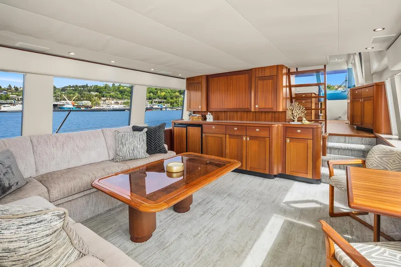 Slide: The Image of Luxurious interior of 2003 Pacific Mariner Pilothouse yacht with elegant wood cabinetry and waterfront view. - 6