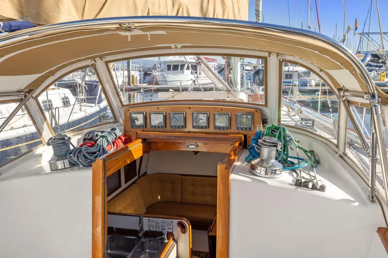 Slide: The Image of 1987 Hinckley Sou'wester 42 sailboat cockpit with navigation instruments and coiled ropes. - 22