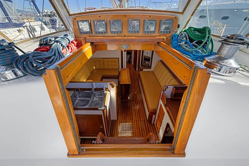Slide: The Image of Interior view of 1987 Hinckley Sou'wester 42 sailboat with wood finish and nautical equipment. - 24