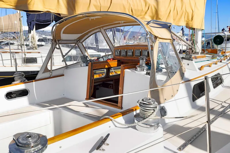 Slide: The Image of 1987 Hinckley Sou'wester 42 sailboat cockpit with canopy and winches in marina setting. - 4