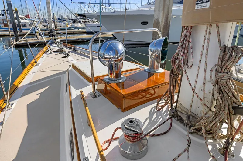 Slide: The Image of 1987 Hinckley Sou'wester 42 sailboat deck with winches and ropes in marina. - 11