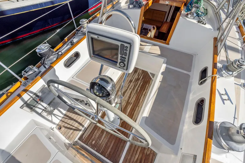 Slide: The Image of Cockpit of 1987 Hinckley Sou'wester 42 sailboat with steering wheel and navigation equipment. - 17