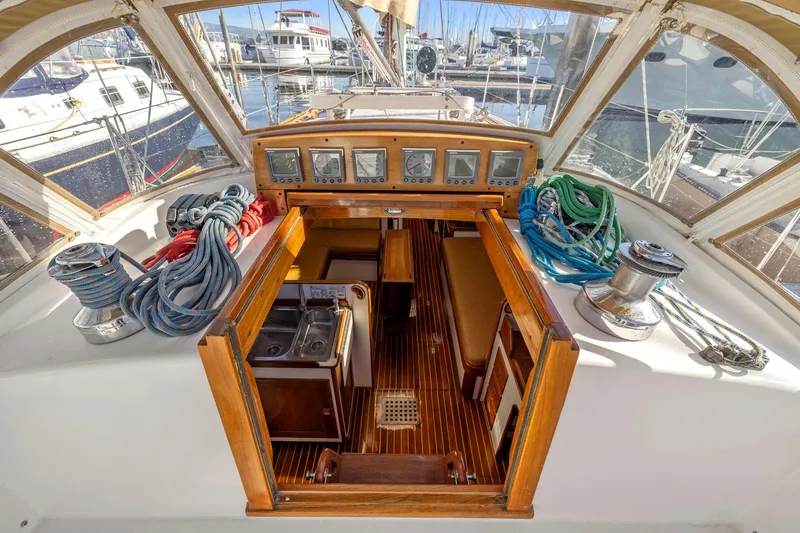Slide: The Image of 1987 Hinckley Sou'wester 42 yacht cockpit with navigation instruments and cabin entrance. - 23