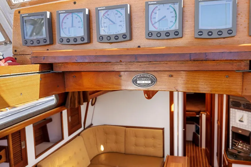 Slide: The Image of Interior of 1987 Hinckley Sou'wester 42 yacht with navigation instruments and cozy seating area. - 25