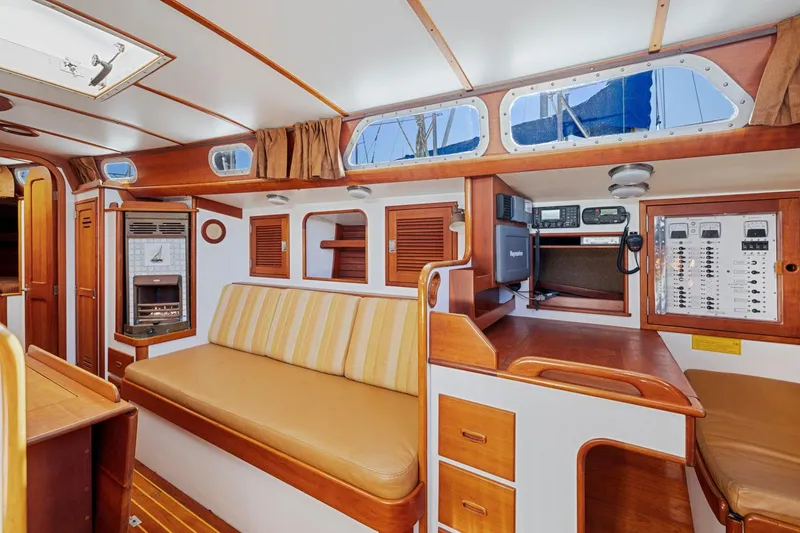 Slide: The Image of Interior of 1987 Hinckley Sou'wester 42 sailboat with wood finish and seating area. - 27