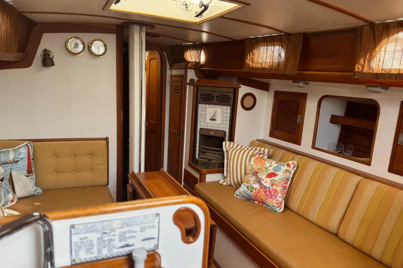 Slide: The Image of Interior of 1987 Hinckley Sou'wester 42 sailboat with cozy seating and nautical decor. - 35