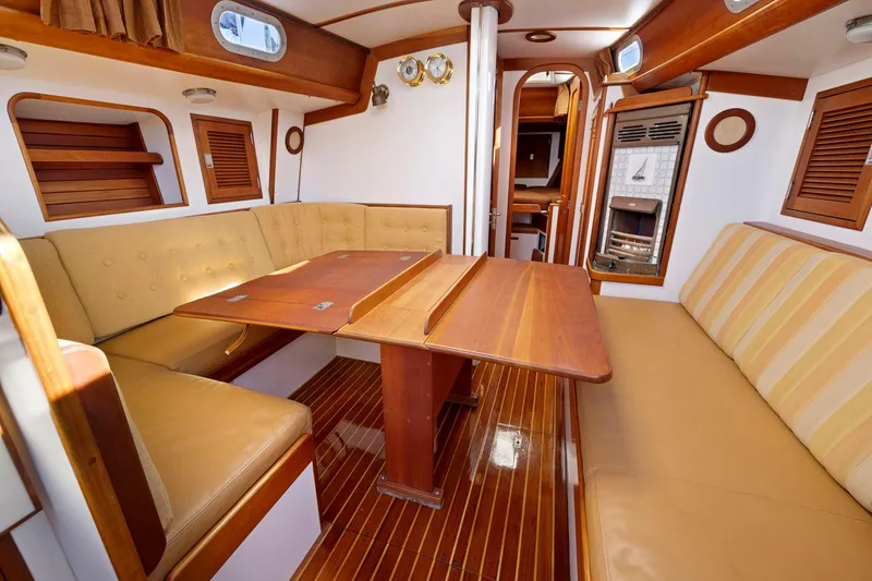Slide: The Image of Interior of 1987 Hinckley Sou'wester 42 sailboat with wooden table and seating. - 36