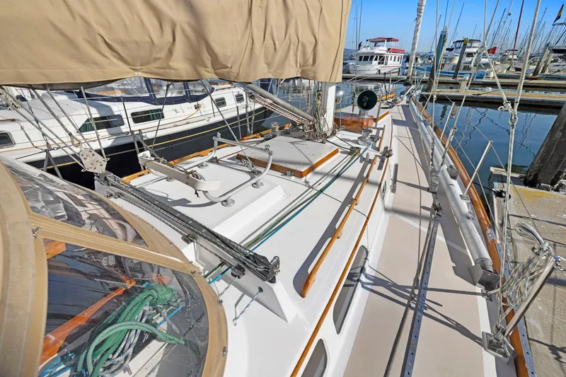 Slide: The Image of 1987 Hinckley Sou'wester 42 sailboat deck view at marina. - 5