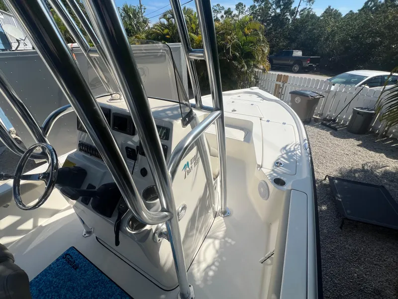 Slide: The Image of 2021 Key West 210 Bay Reef boat, featuring a sleek console and spacious deck. - 13