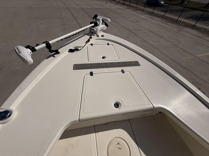 Slide: The Image of Bow of a 2021 Mako 18 LTS boat with trolling motor and measurement ruler. - 10
