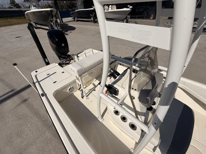 Slide: The Image of 2021 Mako 18 LTS boat with Stryker T-Top, featuring a Mercury outboard motor. - 13