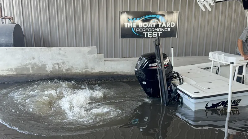 Slide: The Image of Mako 18 LTS 2021 boat undergoing performance test in water at The Boat Yard. - 14