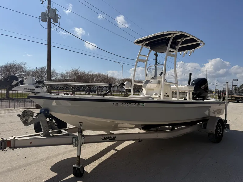 Slide: The Image of 2021 Mako 18 LTS boat on trailer, sunny day, clear sky background. - 7