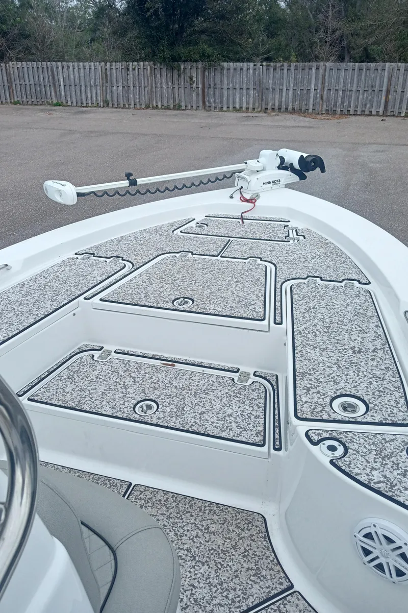 Slide: The Image of 2019 Sportsman Masters 227 Bay Boat deck with trolling motor, featuring non-slip surface. - 4