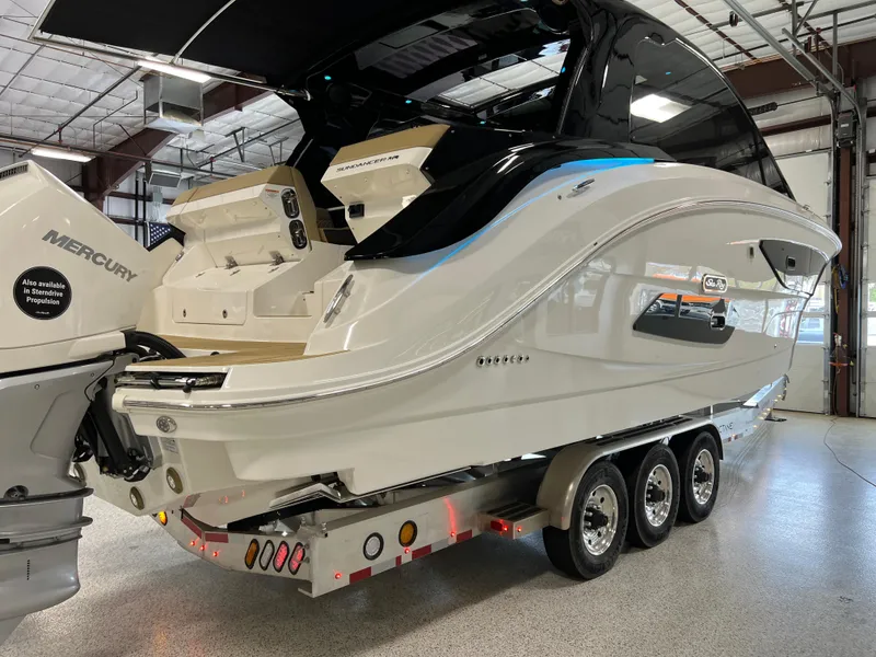 Slide: The Image of 2025 Sea Ray Sundancer 370 OB on trailer in indoor showroom. - 11