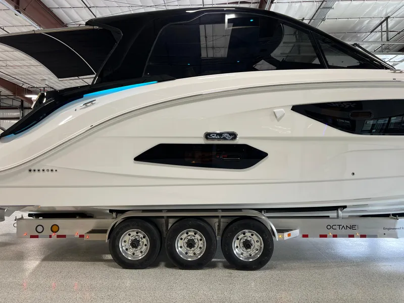 Slide: The Image of 2025 Sea Ray Sundancer 370 OB on trailer in indoor storage facility. - 12