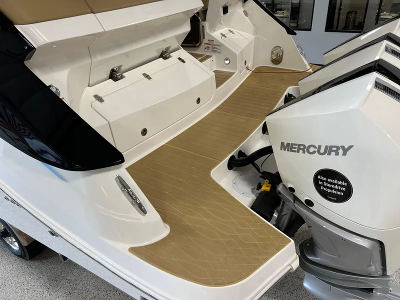 Slide: The Image of 2025 Sea Ray Sundancer 370 OB interior with tan seating and modern controls. - 15