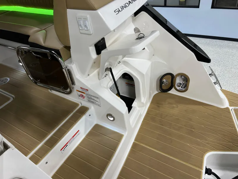 Slide: The Image of 2025 Sea Ray Sundancer 370 OB utility compartment with wiring and connections. - 16