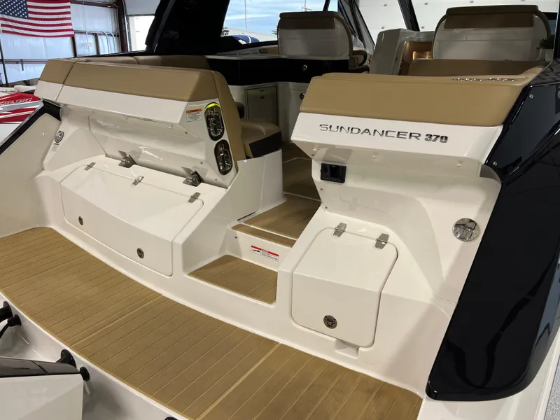 Slide: The Image of 2025 Sea Ray Sundancer 370 OB interior with tan seating and modern design. - 19
