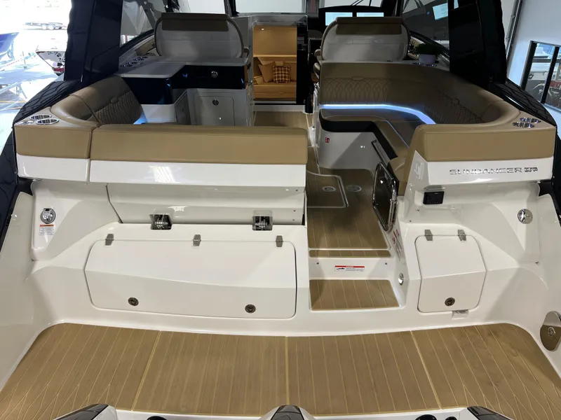Slide: The Image of 2025 Sea Ray Sundancer 370 OB interior with modern seating and ambient lighting. - 20