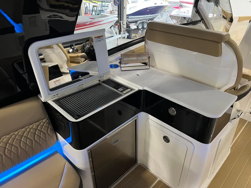 Slide: The Image of 2025 Sea Ray Sundancer 370 OB interior with luxurious seating and modern dashboard. - 23