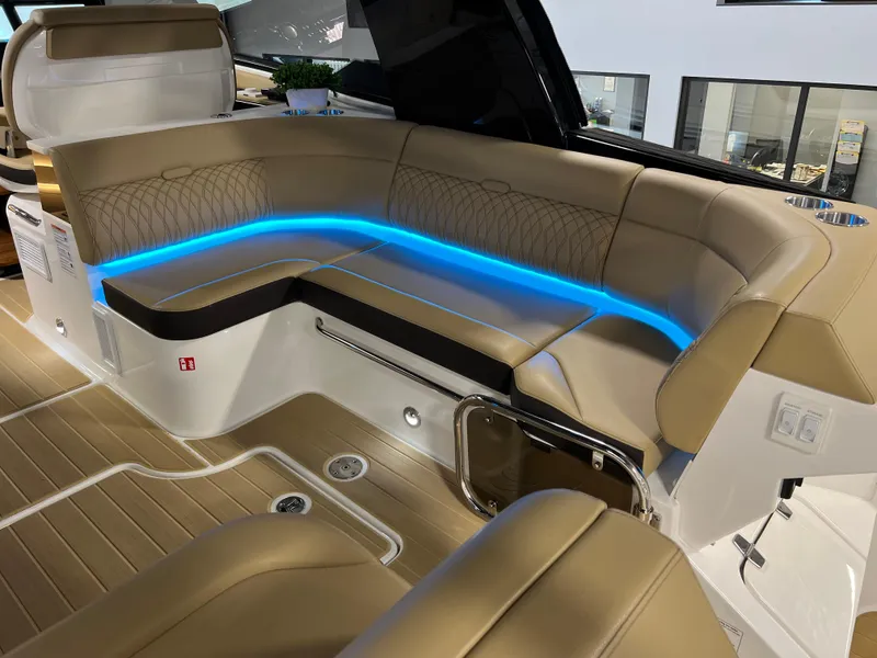 Slide: The Image of 2025 Sea Ray Sundancer 370 OB interior with modern helm, dual screens, and luxurious seating. - 25