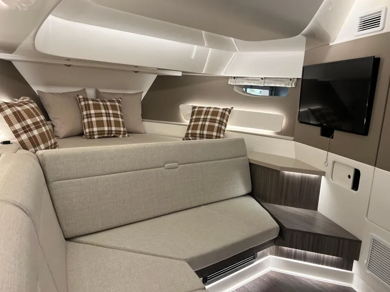 Slide: The Image of Interior of 2025 Sea Ray Sundancer 370 OB yacht, featuring modern design and wooden accents. - 33