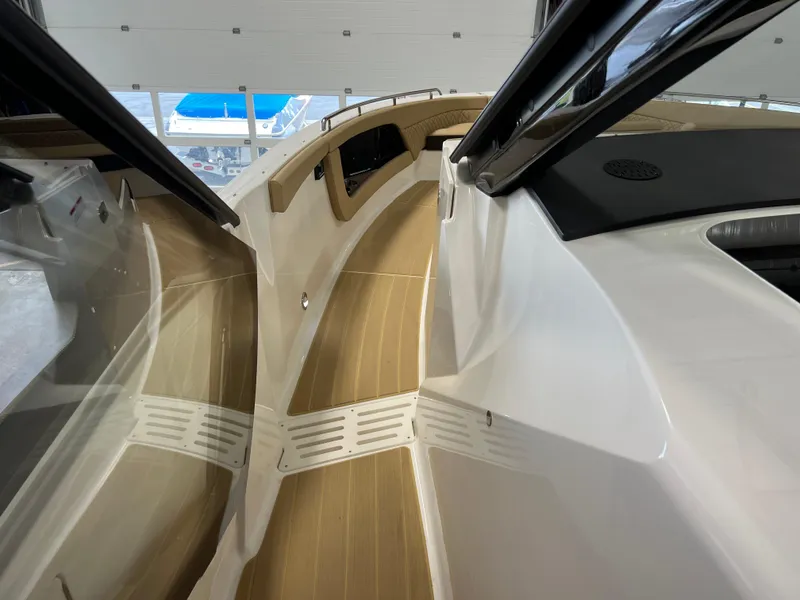 Slide: The Image of 2025 Sea Ray Sundancer 370 OB interior with luxurious tan seating and spacious layout. - 40