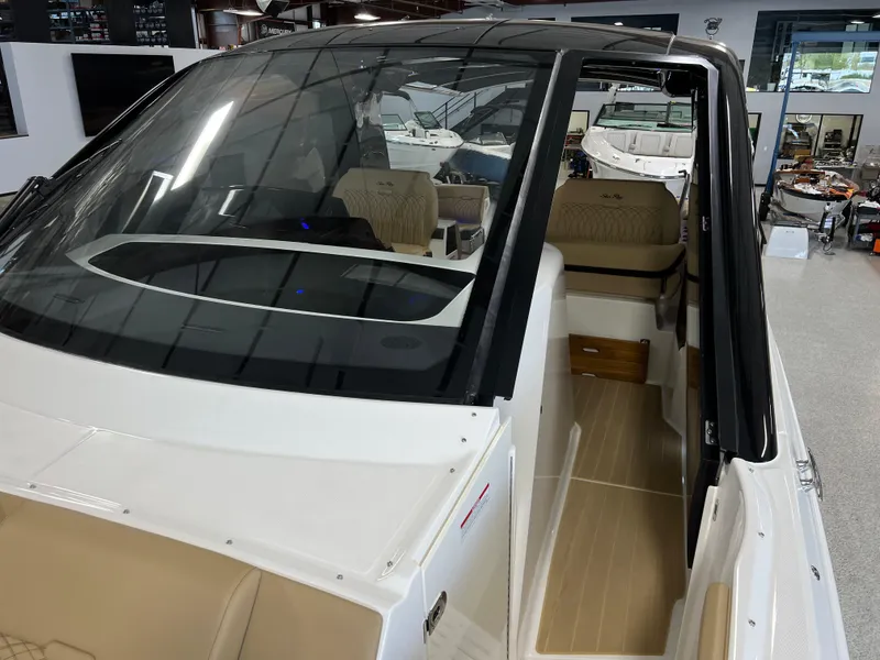 Slide: The Image of 2025 Sea Ray Sundancer 370 OB interior with luxurious seating and modern design. - 46