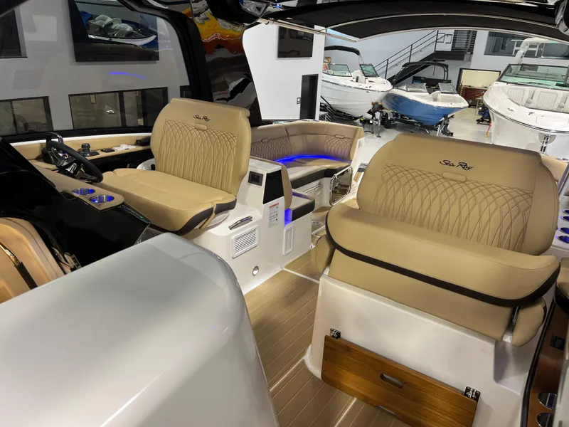 Slide: The Image of 2025 Sea Ray Sundancer 370 OB helm with luxurious seating and modern controls. - 47