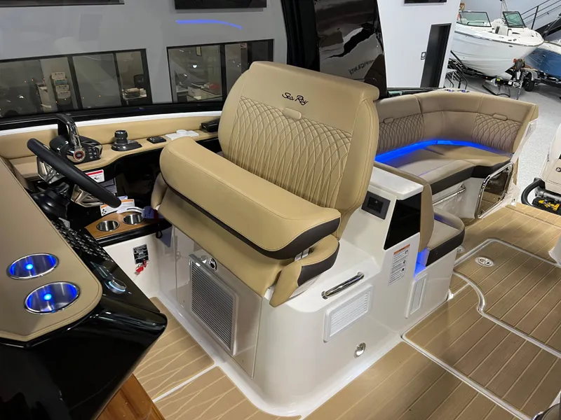 Slide: The Image of 2025 Sea Ray Sundancer 370 OB cockpit with luxurious seating and modern controls. - 48