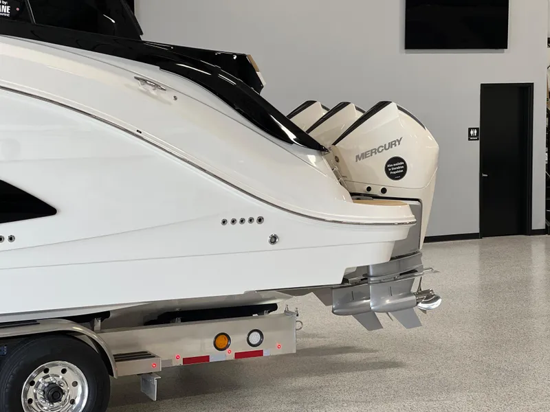 Slide: The Image of 2025 Sea Ray Sundancer 370 OB with Mercury outboard engines on a trailer. - 5