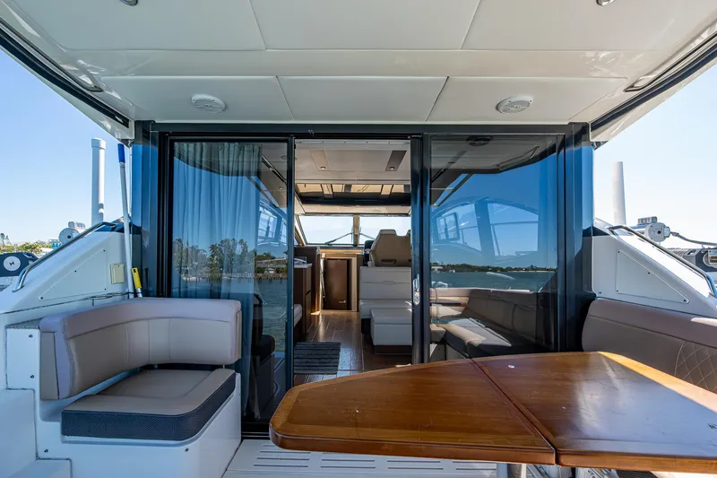 Slide: The Image of 2017 Sea Ray Sundancer 400 yacht interior with seating and table. - 25