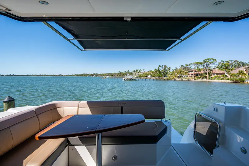 Slide: The Image of 2017 Sea Ray Sundancer 400 yacht with scenic water view and comfortable seating area. - 28