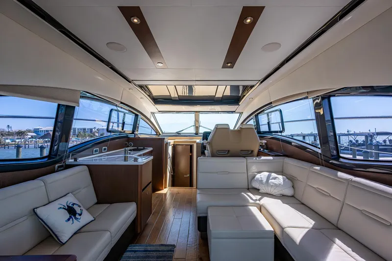 Slide: The Image of Luxurious interior of 2017 Sea Ray Sundancer 400 yacht with modern seating and panoramic windows. - 30