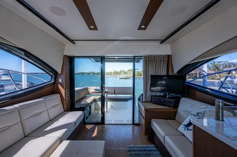 Slide: The Image of Interior of 2017 Sea Ray Sundancer 400 yacht with luxurious seating and scenic water view. - 31