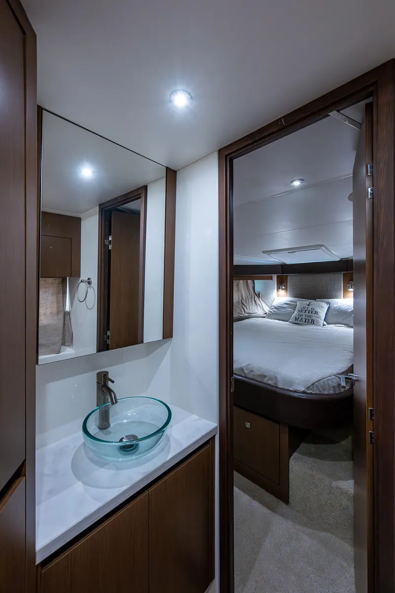 Slide: The Image of 2017 Sea Ray Sundancer 400 interior with modern bathroom and cozy bedroom. - 43