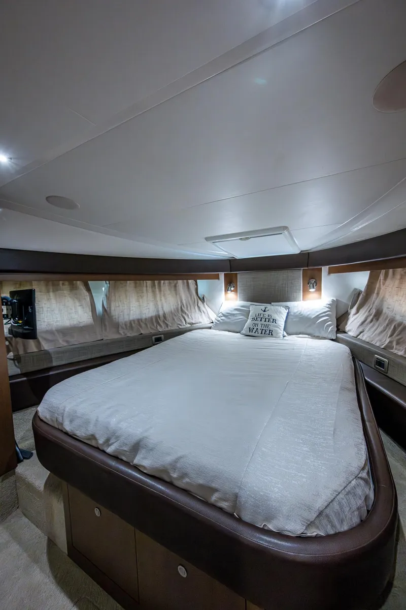 Slide: The Image of 2017 Sea Ray Sundancer 400 cabin interior with bed and ambient lighting. - 49